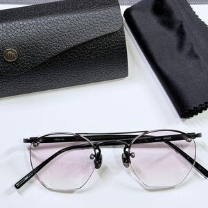 Matte black Matsuda M3117 with lightly tinted purple gradient lenses